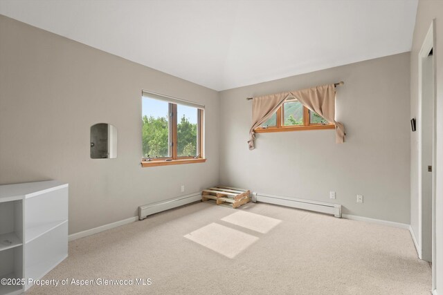 287 Southside Dr, Basalt, CO 81621 - empty room with baseboard heating, a baseboard heating unit, plenty of natural light, and carpet floors