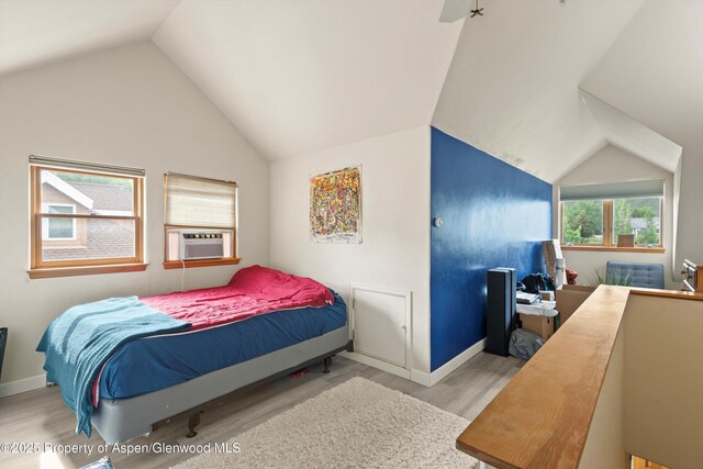 287 Southside Dr, Basalt, CO 81621 - bedroom with wood finished floors, lofted ceiling, cooling unit, and baseboards