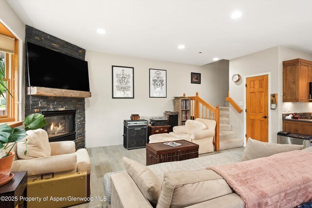 287 Southside Dr, Basalt, CO 81621 - living room featuring wood finished floors, stairway, a stone fireplace, and recessed lighting