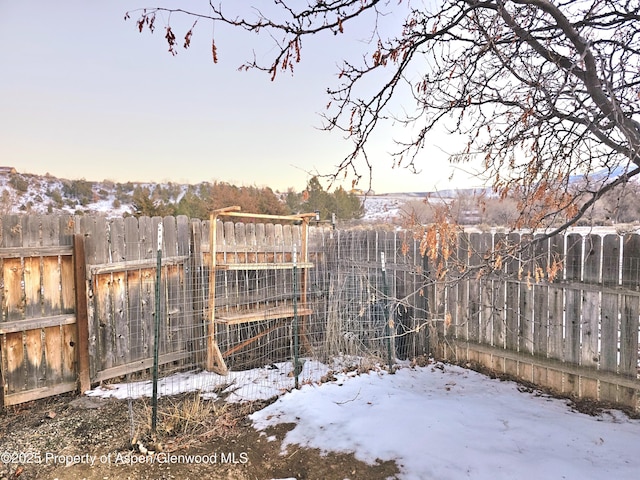 view of yard layered in snow