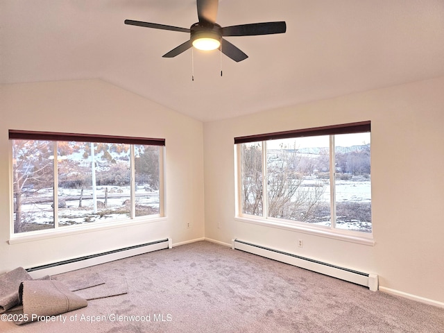 unfurnished room with ceiling fan, baseboard heating, lofted ceiling, and carpet flooring