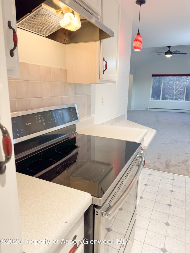 kitchen with ceiling fan, backsplash, white cabinets, and stainless steel electric range