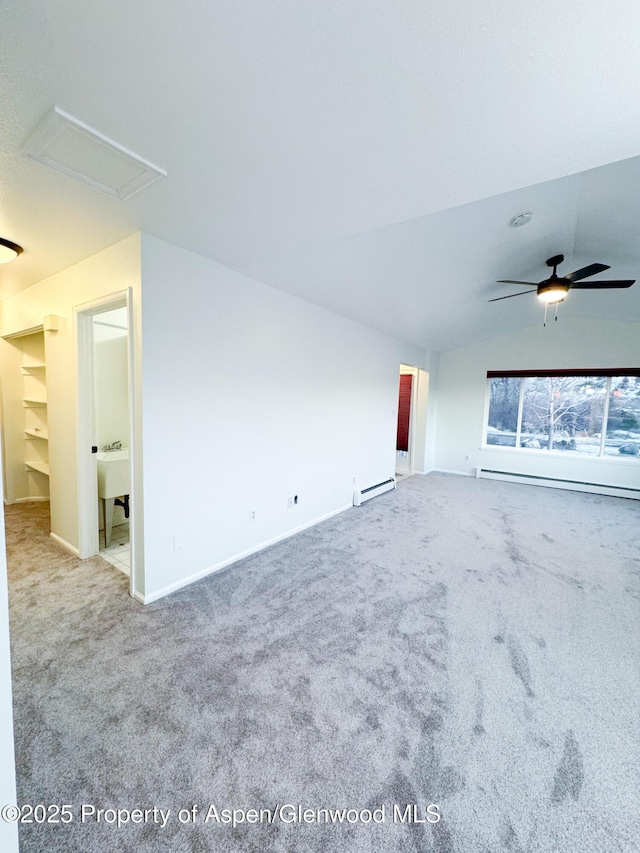 carpeted spare room featuring ceiling fan, baseboard heating, and lofted ceiling