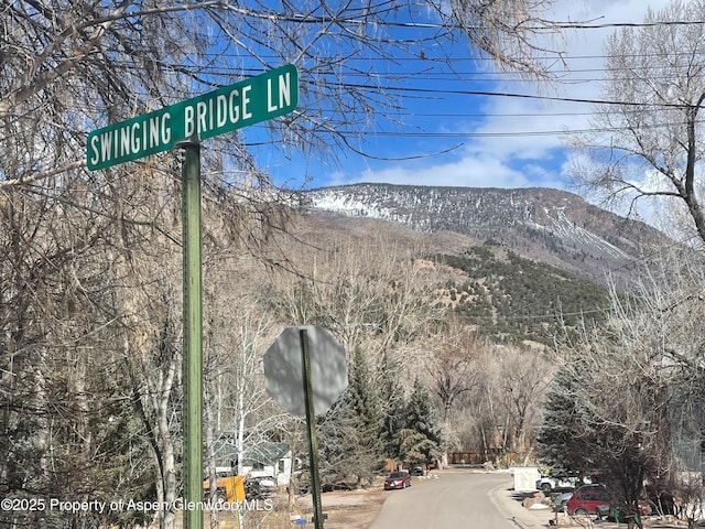 exterior space with traffic signs and a mountain view