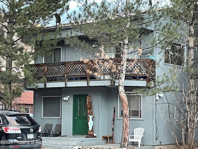 view of front of property with a balcony