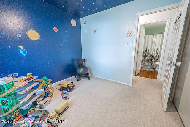 unfurnished bedroom featuring baseboards and carpet