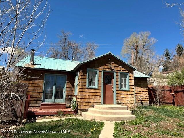 900 Breeze St, Craig, CO 81625 - view of front of property featuring fence and metal roof