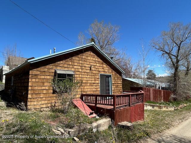900 Breeze St, Craig, CO 81625 - rear view of property featuring a wooden deck and fence