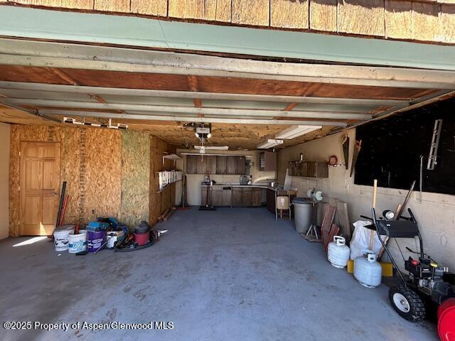 900 Breeze St, Craig, CO 81625 - garage featuring a garage door opener