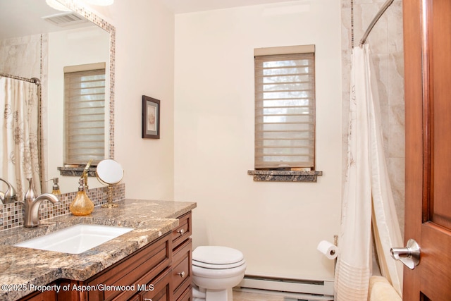 368 Meadow Ln, Glenwood Springs, CO 81601 - full bath with a baseboard heating unit, toilet, vanity, and a shower with curtain