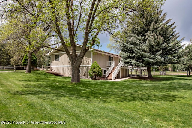 368 Meadow Ln, Glenwood Springs, CO 81601 - view of green lawn featuring stairs and a deck