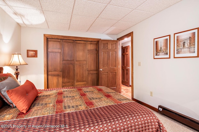 368 Meadow Ln, Glenwood Springs, CO 81601 - carpeted bedroom with a baseboard heating unit, a closet, and baseboards