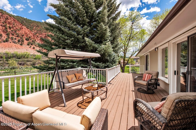 368 Meadow Ln, Glenwood Springs, CO 81601 - deck featuring an outdoor hangout area, a lawn, and a mountain view