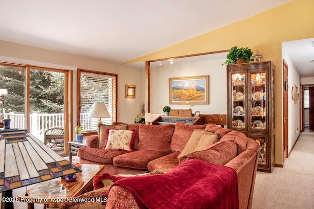 368 Meadow Ln, Glenwood Springs, CO 81601 - living area featuring light colored carpet, lofted ceiling, and plenty of natural light