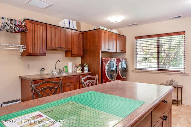 368 Meadow Ln, Glenwood Springs, CO 81601 - kitchen featuring washer and dryer, a sink, brown cabinetry, and light countertops