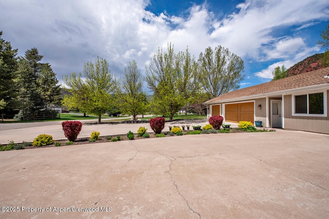 368 Meadow Ln, Glenwood Springs, CO 81601 - view of patio featuring concrete driveway and a garage