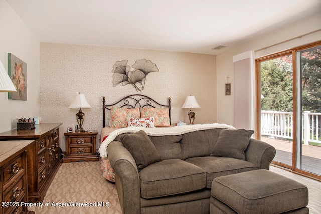 368 Meadow Ln, Glenwood Springs, CO 81601 - bedroom with access to exterior, light colored carpet, and wallpapered walls