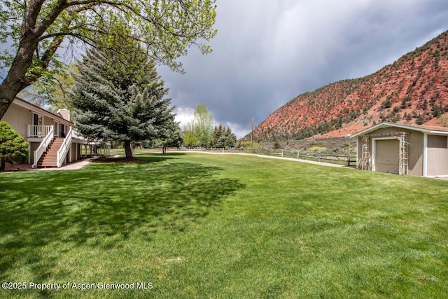 368 Meadow Ln, Glenwood Springs, CO 81601 - view of yard with stairway, an outbuilding, and a deck with mountain view