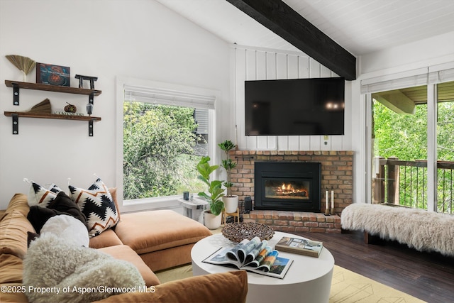 35 Upper Woodbridge Rd Unit 18-Cd, Snowmass Village, CO 81615 - living room featuring wood finished floors, healthy amount of natural light, and a brick fireplace