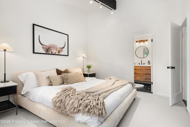 35 Upper Woodbridge Rd Unit 18-Cd, Snowmass Village, CO 81615 - bedroom with light colored carpet, track lighting, and connected bathroom