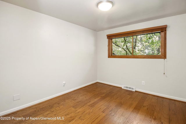 912 Red Mountain Dr, Glenwood Springs, CO 81601 - spare room with baseboards and wood finished floors