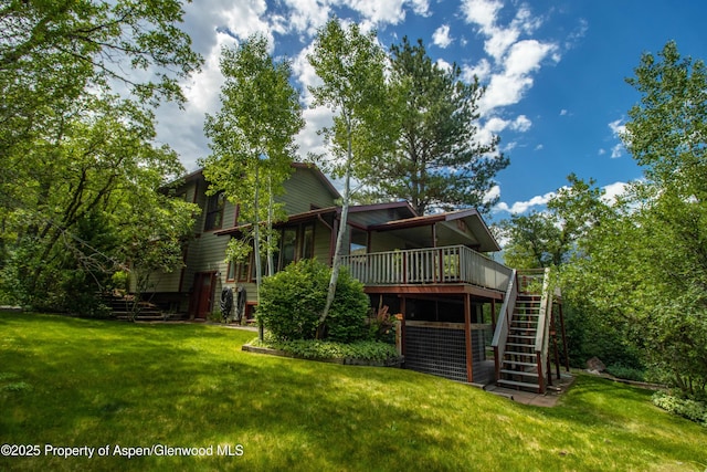 912 Red Mountain Dr, Glenwood Springs, CO 81601 - back of house featuring stairs, a lawn, and a wooden deck