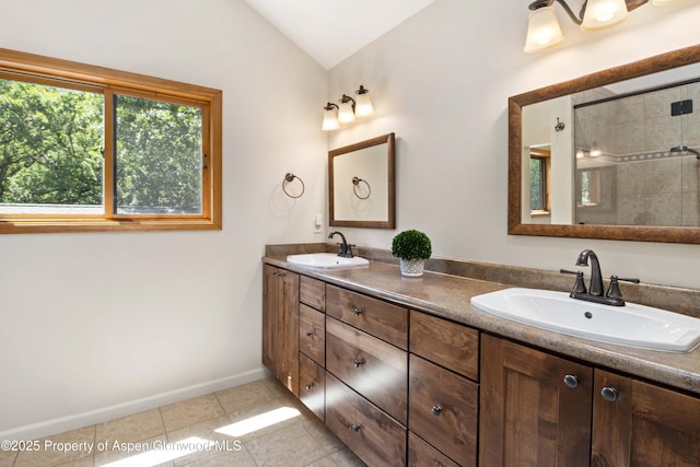 912 Red Mountain Dr, Glenwood Springs, CO 81601 - full bath featuring tile patterned flooring, double vanity, vaulted ceiling, and tiled shower