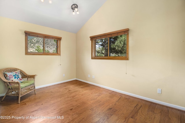 912 Red Mountain Dr, Glenwood Springs, CO 81601 - unfurnished room featuring wood finished floors and lofted ceiling