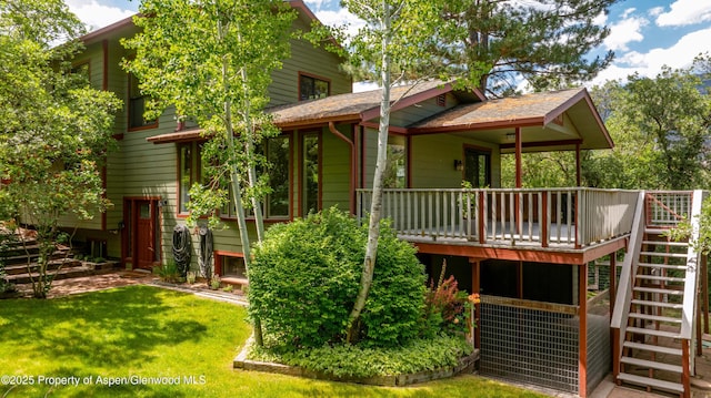 912 Red Mountain Dr, Glenwood Springs, CO 81601 - back of property featuring stairway, a lawn, and a deck