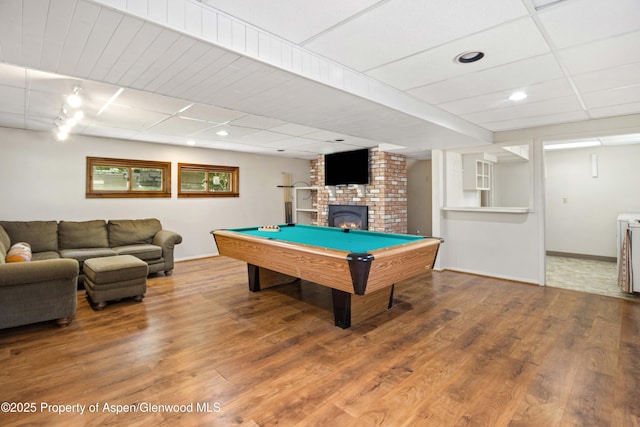 912 Red Mountain Dr, Glenwood Springs, CO 81601 - playroom featuring wood finished floors, billiards, a brick fireplace, recessed lighting, and washer / clothes dryer
