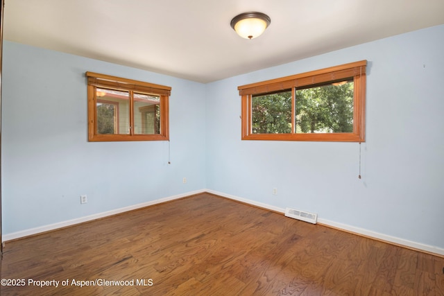 912 Red Mountain Dr, Glenwood Springs, CO 81601 - empty room featuring baseboards and wood finished floors
