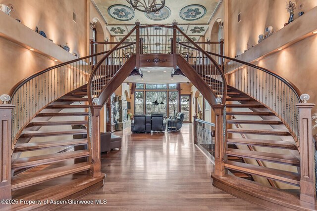 81 River Park Ln, Carbondale, CO 81623 - staircase with a high ceiling, wood finished floors, and arched walkways