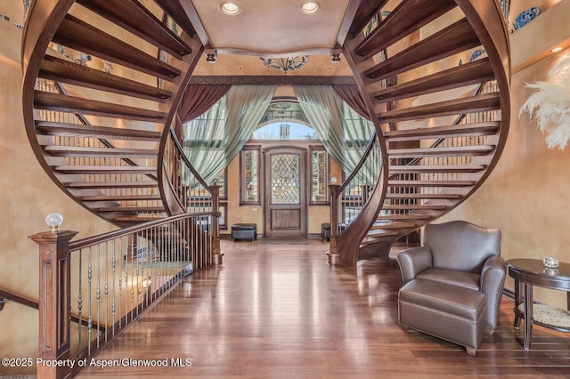 81 River Park Ln, Carbondale, CO 81623 - entrance foyer with stairs, wood finished floors, baseboards, a high ceiling, and recessed lighting