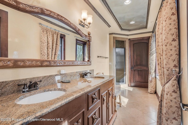 81 River Park Ln, Carbondale, CO 81623 - full bath featuring double vanity, a tray ceiling, tile patterned flooring, ornamental molding, and recessed lighting