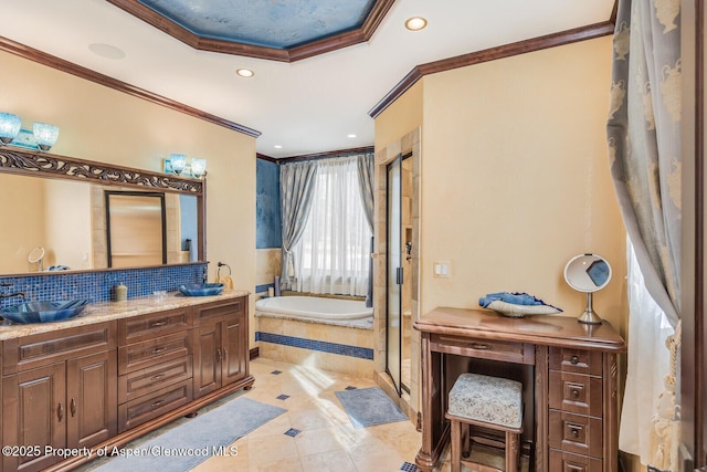 81 River Park Ln, Carbondale, CO 81623 - full bath with crown molding, a garden tub, double vanity, recessed lighting, and tile patterned floors