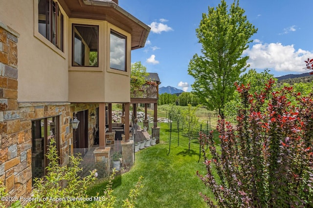 81 River Park Ln, Carbondale, CO 81623 - view of green lawn with a deck with mountain view