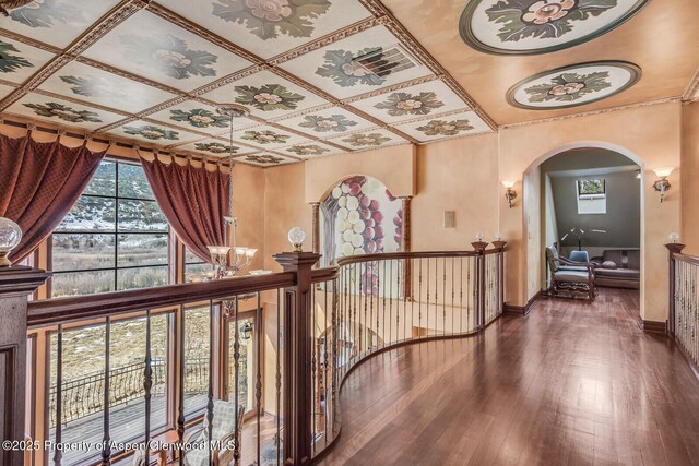 81 River Park Ln, Carbondale, CO 81623 - hallway with arched walkways, healthy amount of natural light, hardwood / wood-style flooring, and baseboards