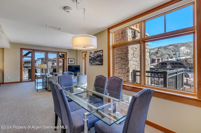 110 Carriage Way Unit 3210, Snowmass Village, CO 81615 - carpeted dining area featuring baseboards