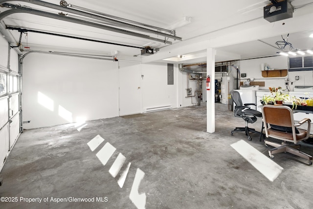 garage with a garage door opener, a baseboard radiator, water heater, washer and dryer, and electric panel