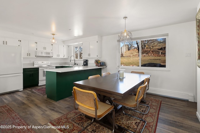 dining area featuring a baseboard radiator, dark wood-style flooring, and baseboards