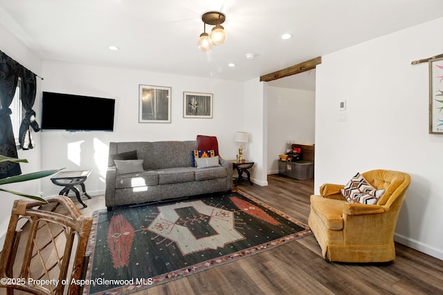 living area with recessed lighting, wood finished floors, and baseboards