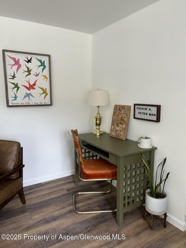 office area with baseboards and wood finished floors