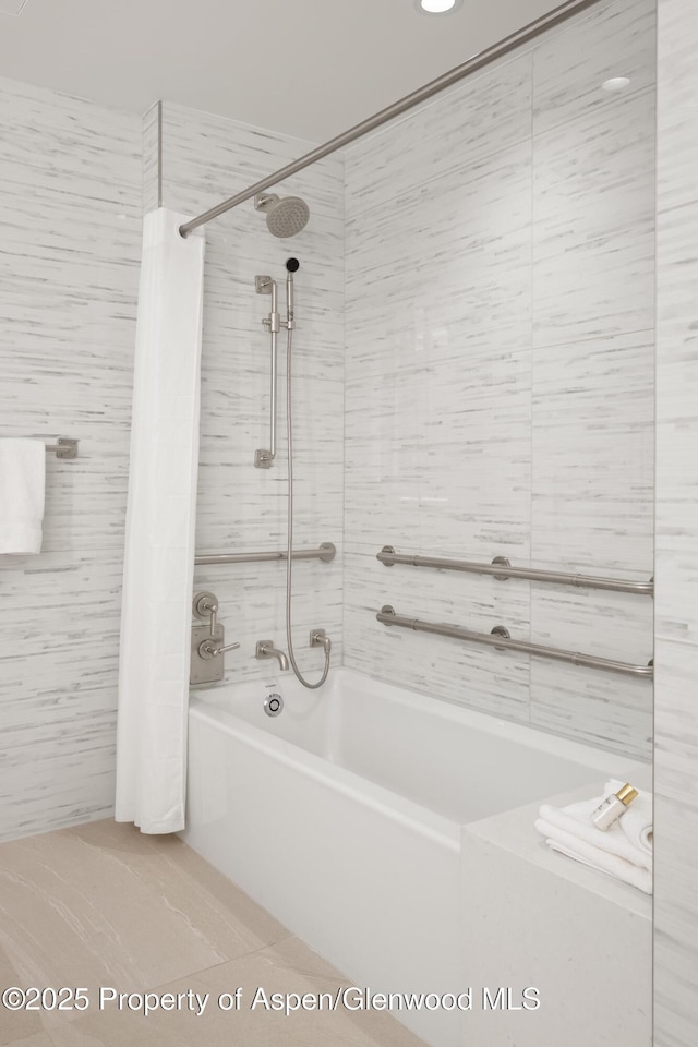 130 Wood Rd Unit 264, Snowmass Village, CO 81615 - bathroom featuring tile walls, shower / tub combination, and tile patterned flooring