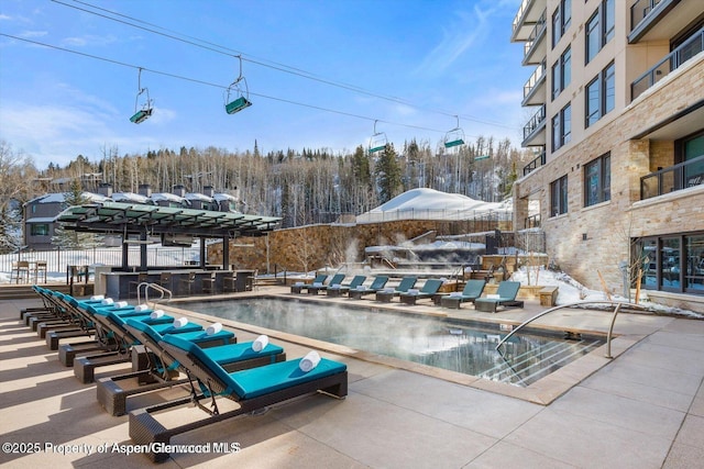 130 Wood Rd Unit 264, Snowmass Village, CO 81615 - community pool with a patio area