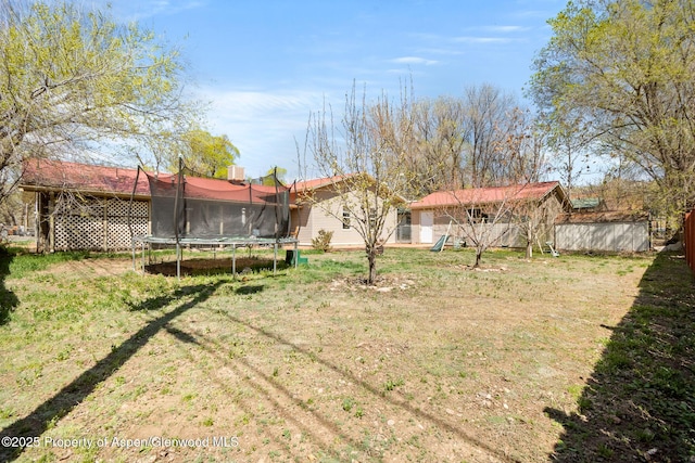 view of yard featuring a trampoline