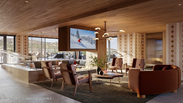 221 Wood Rd Unit 718, Snowmass Village, CO 81615 - common area featuring wooden ceiling, a mountain view, and floor to ceiling windows