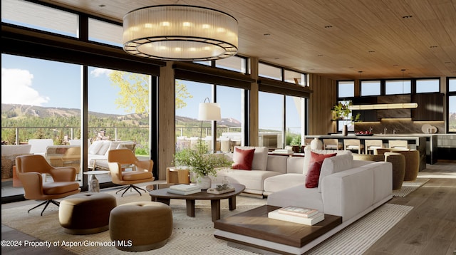 221 Wood Rd Unit 718, Snowmass Village, CO 81615 - living room with floor to ceiling windows, wood finished floors, wooden ceiling, and a mountain view