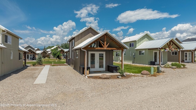 329 River Frontage Rd Unit 65, Silt, CO 81652 - rear view of property with french doors, a residential view, and board and batten siding