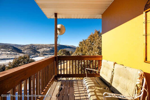 wooden terrace featuring a mountain view