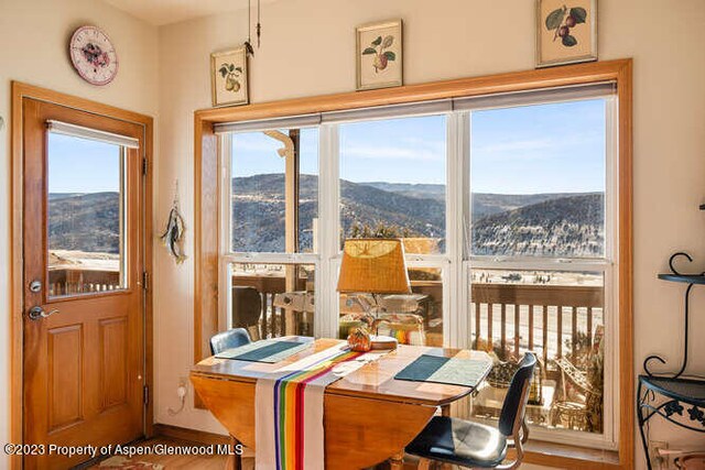 interior space featuring a wealth of natural light and a mountain view